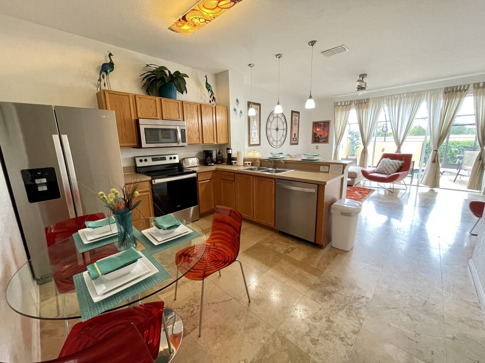 Kitchen with new stainless steel appliances.
