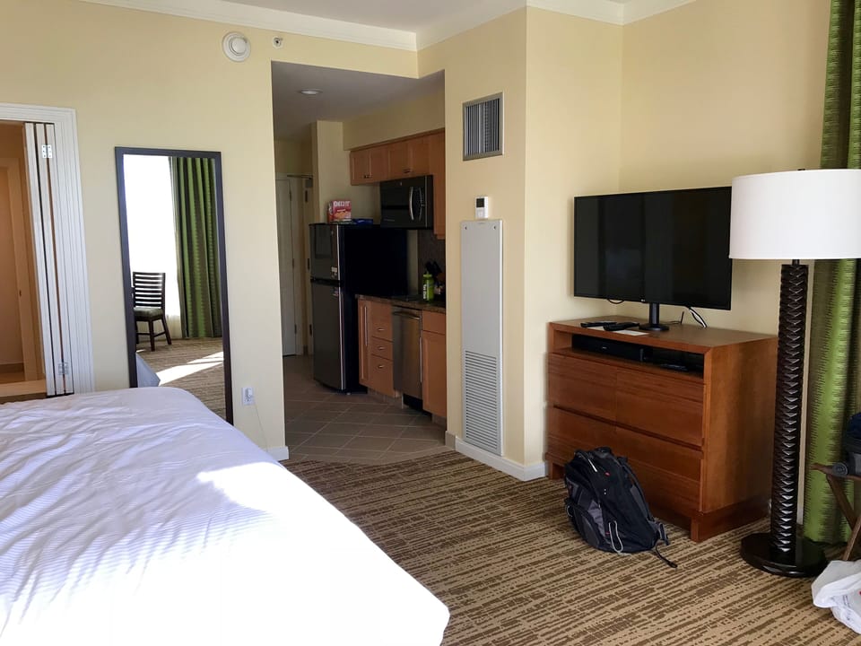 Attached studio bedroom and half kitchen
