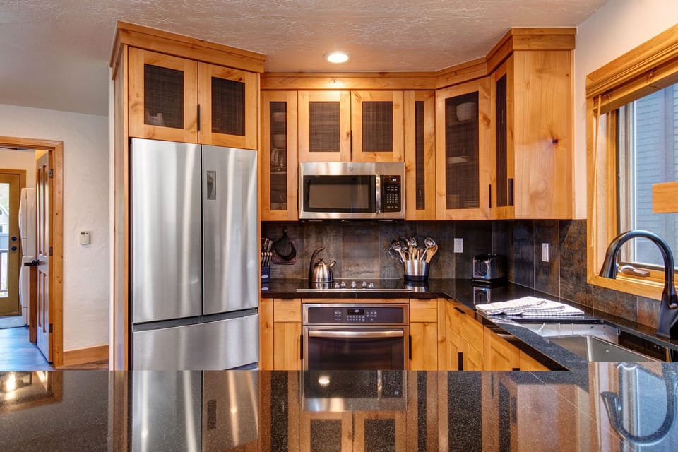 Newly Remodeled, Fully Equipped Kitchen with Gorgeous Stone Countertops, and New GE Stainless Steel Appliances