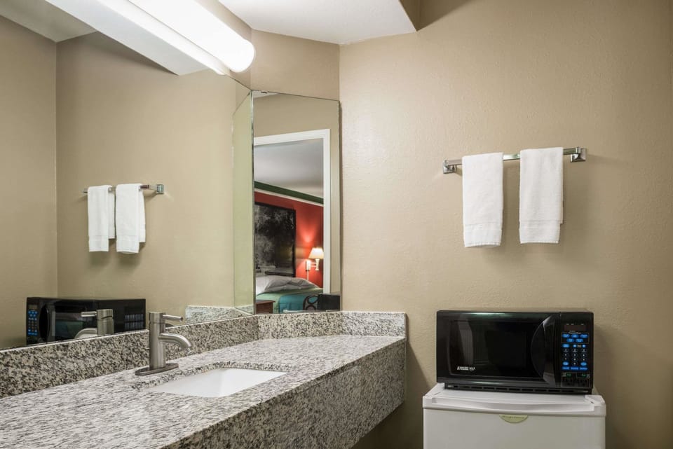 Combined shower/tub, hair dryer, towels, soap
