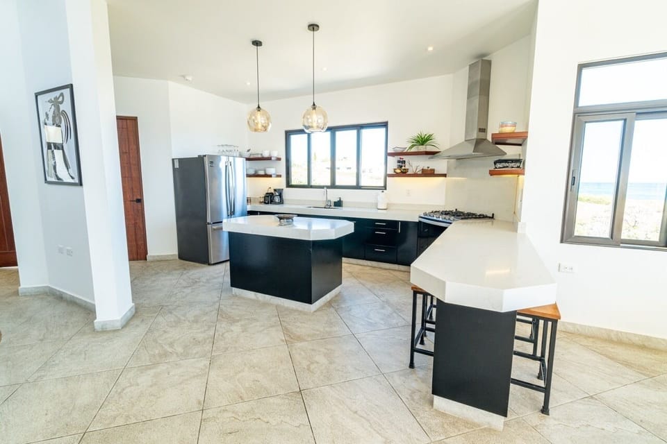 Kitchen opens to dining and terrace