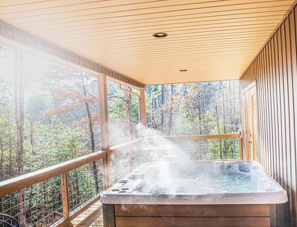 Enjoy the jetted hot tub on the covered back porch