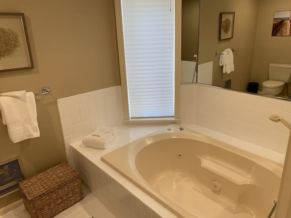 Bathroom #1 (1st Fl Master) on-suite has double vanity, 2 toilets, tub & shower