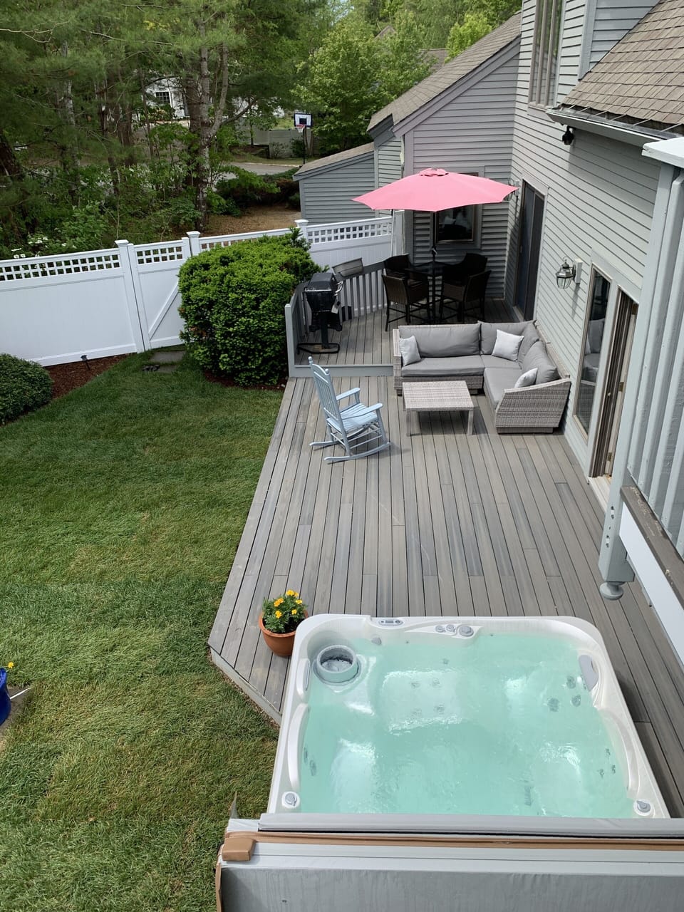 View of the back deck from upstairs master balcony