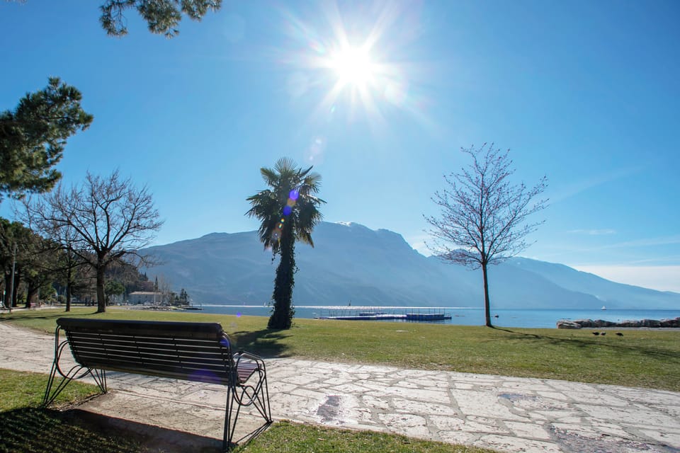The lake, the lawn and the pedestrian path that connect Riva to Torbole