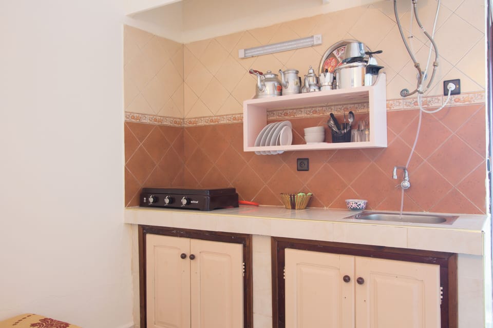 Standard Studio, 1 Bedroom, Balcony, Pool View | Private kitchen | Fridge, stovetop, cookware/dishes/utensils