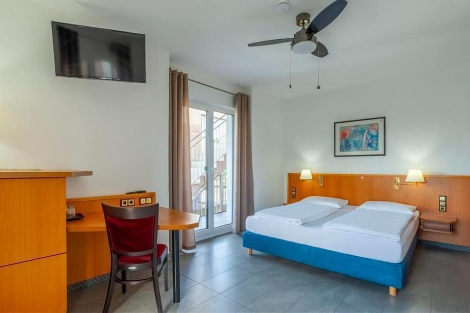 Double Room, Balcony | Minibar, in-room safe, desk, laptop workspace