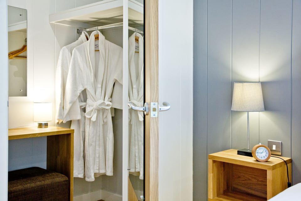 Ensuite to master bedroom, Walk-in shower, freestanding bath, wash basin, WC, shaver point and mirror - Nyland Lodge