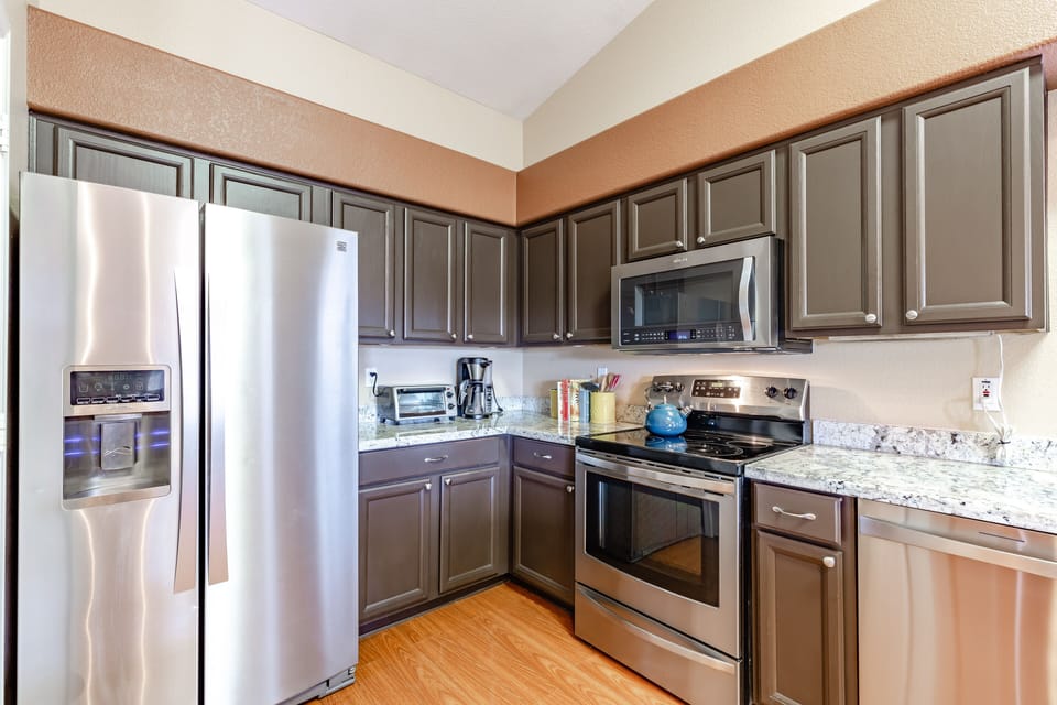 The kitchen features modern appliances. 