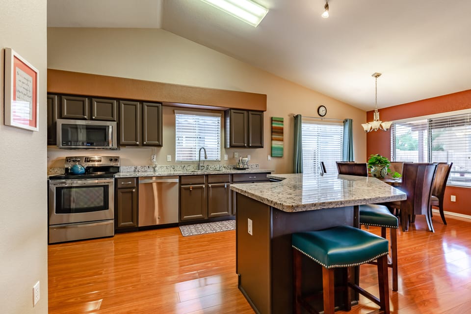 Spacious and modern kitchen featuring a large island.  