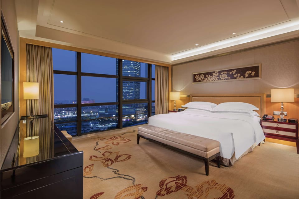 Premium bedding, down comforters, pillowtop beds, minibar