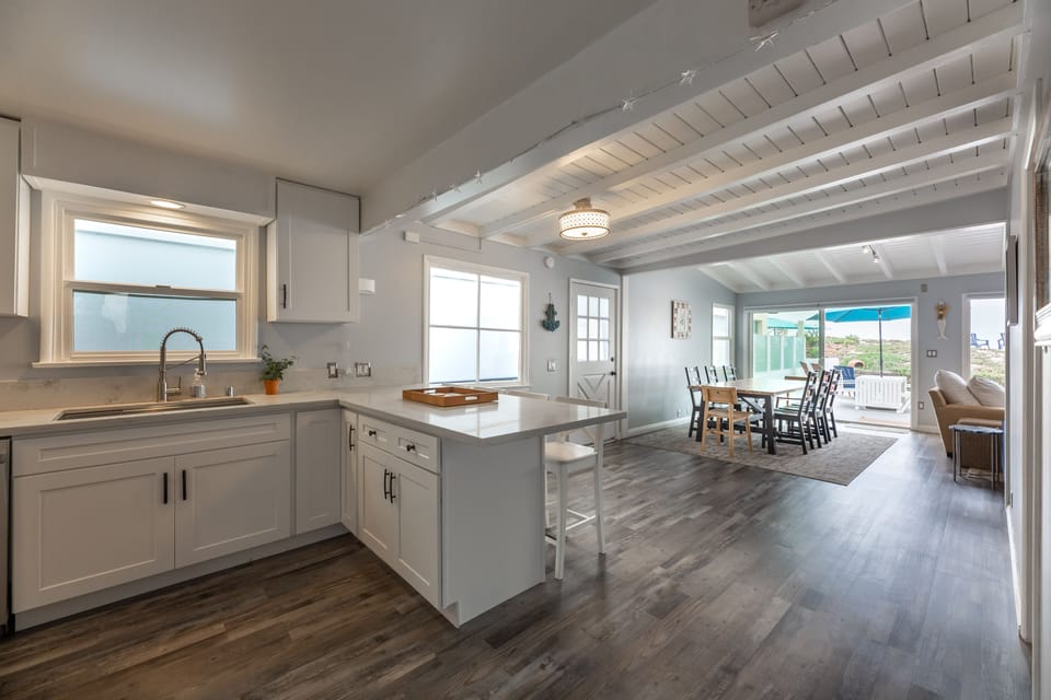 Kitchen, dining room, and living room all with beachfront views