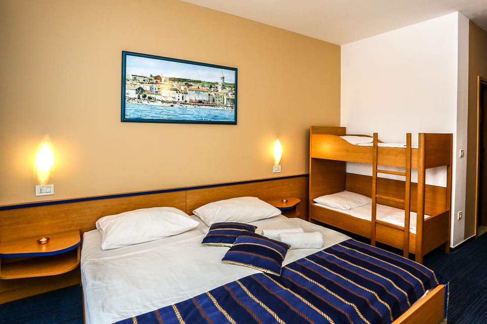 Family Room, Balcony | In-room safe, desk, free WiFi, bed sheets