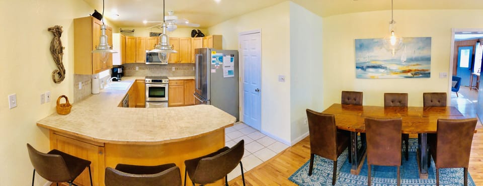Kitchen and dining area with custom live edge table
