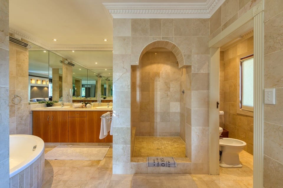 Luxury Room, 1 King Bed | Bathroom | Shower, hair dryer, bathrobes, towels