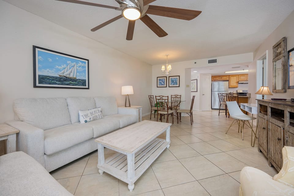 Sunlight fills the living room as you lounge on the sofa with a queen sleeper and plan your next beach adventure
