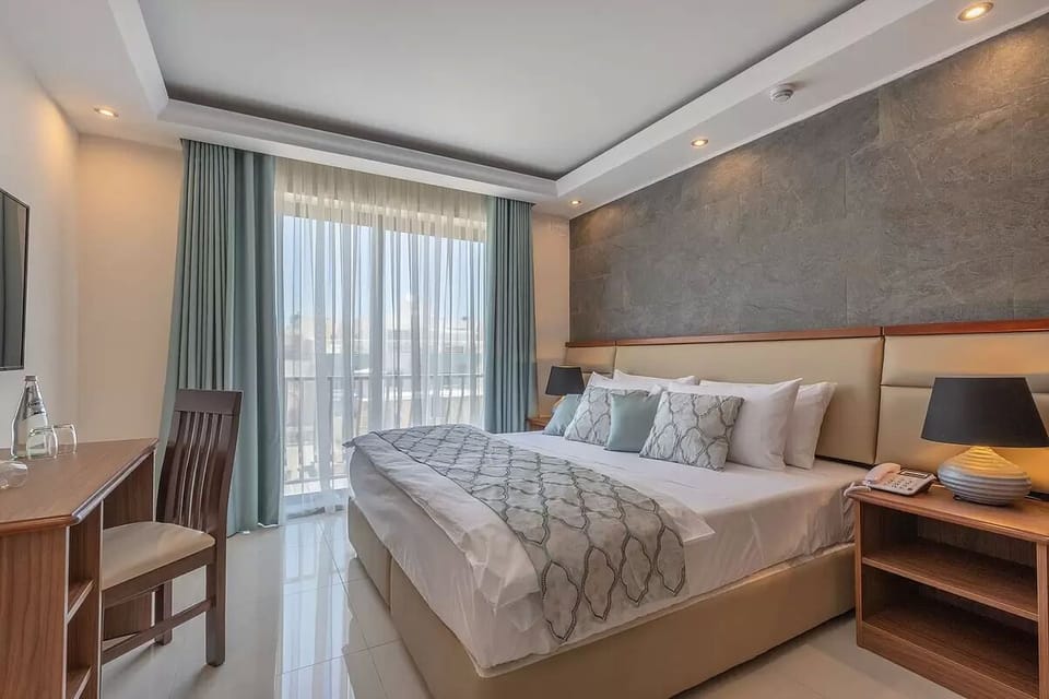 Standard Double or Twin Room | In-room safe, desk, blackout drapes, iron/ironing board