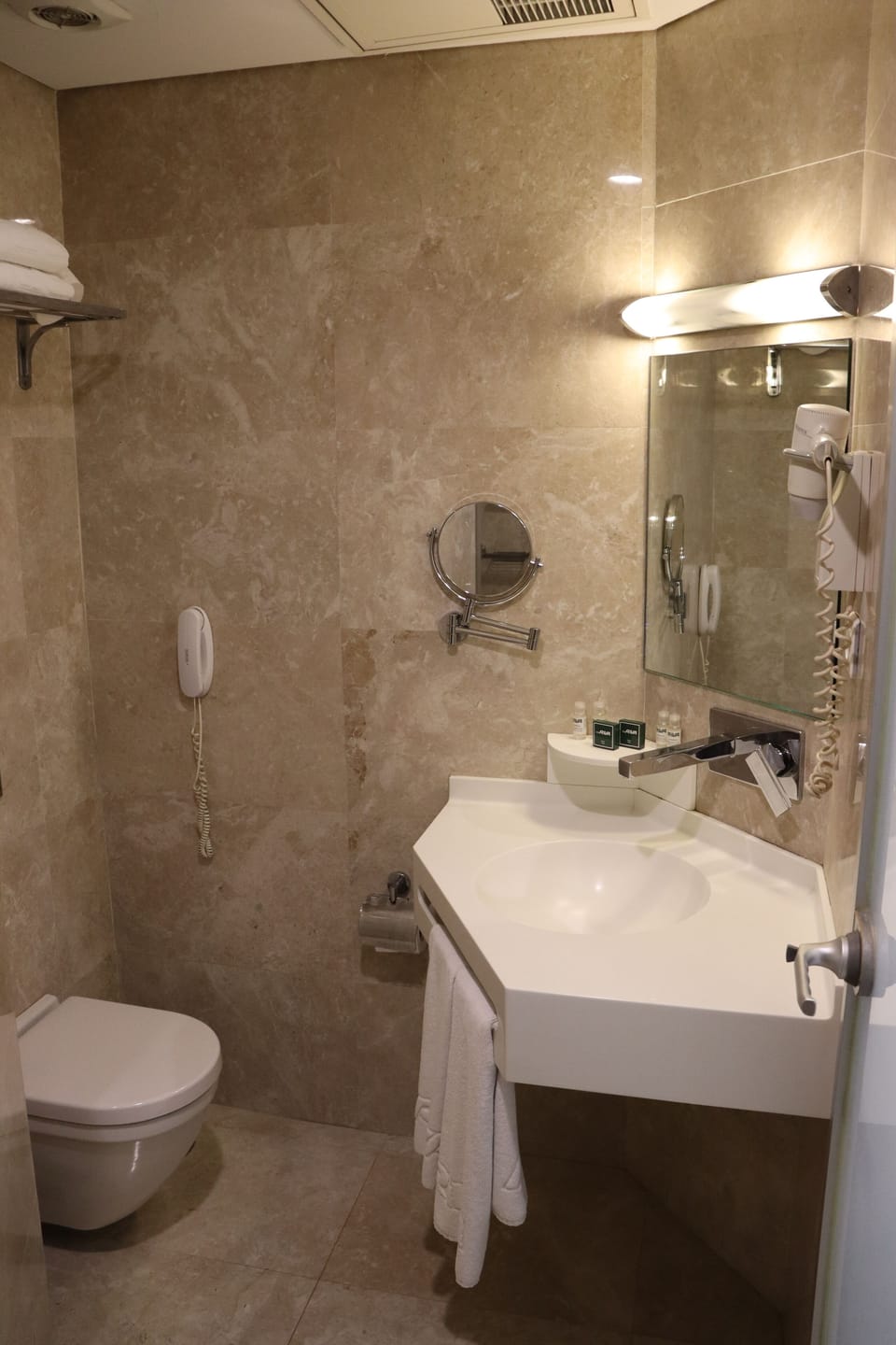 Shower, hair dryer, slippers, towels