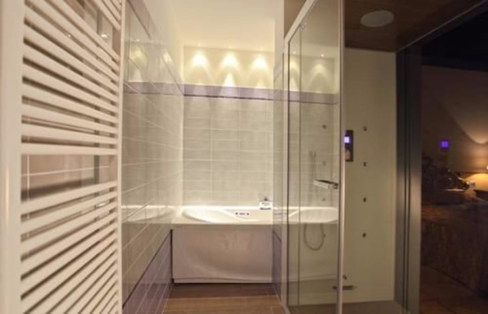 Suite, 1 King Bed | Bathroom | Shower, rainfall showerhead, hair dryer, bidet