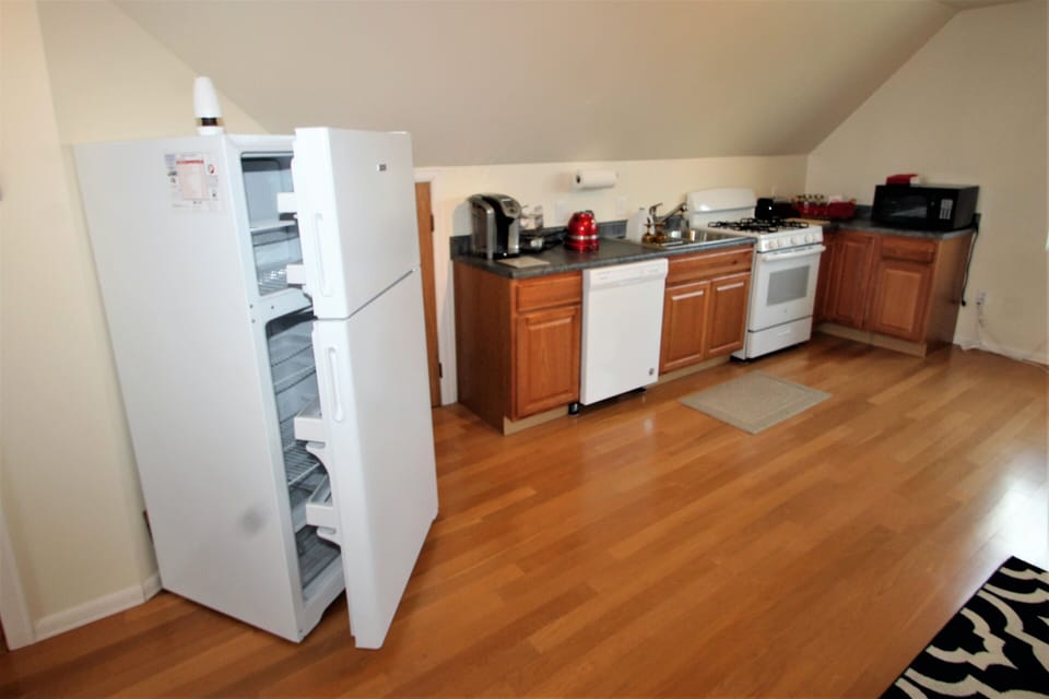 Full size kitchen with refrigerator, electric stove, microwave & dishwasher! 