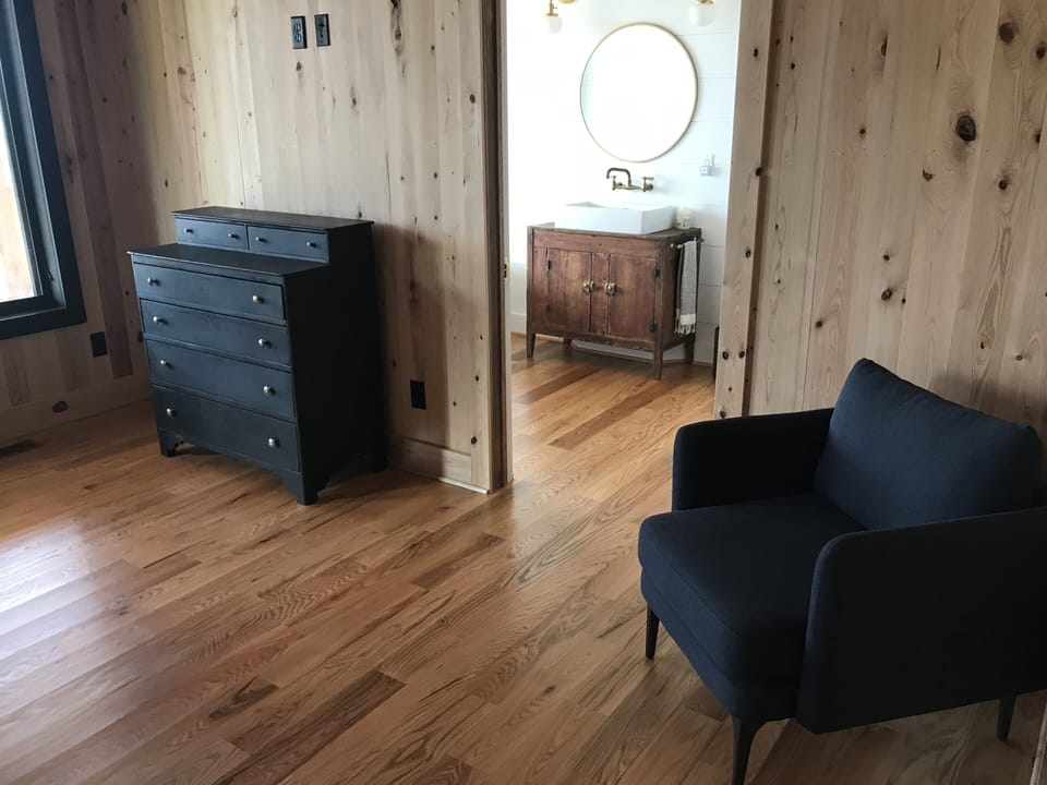Master Bedroom that leads into master bath with claw foot tub and walk in shower
