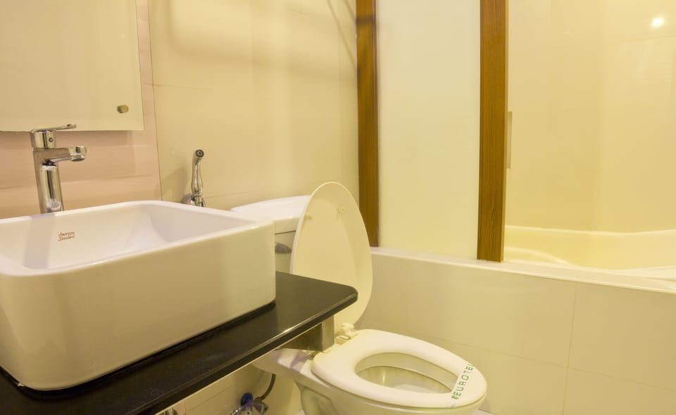 Combined shower/tub, free toiletries, hair dryer, slippers