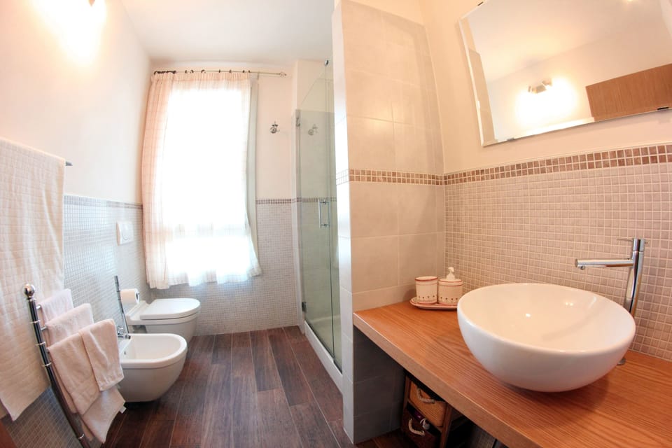 Standard Apartment (for 4 people) | Bathroom | Shower, hair dryer, bidet, towels