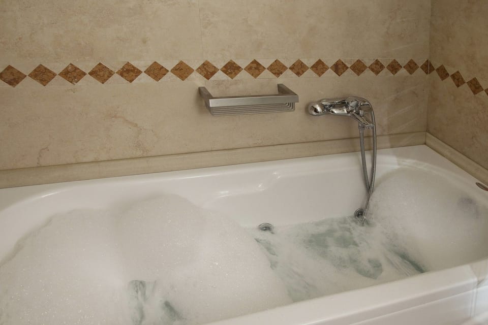 Junior Suite | Bathroom | Designer toiletries, hair dryer, bathrobes, slippers