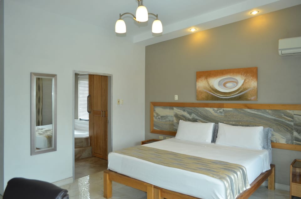 Executive Room, Ensuite | Iron/ironing board, WiFi (free), bed sheets