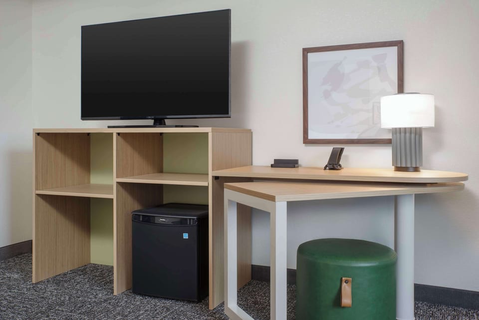 Desk, laptop workspace, blackout drapes, iron/ironing board