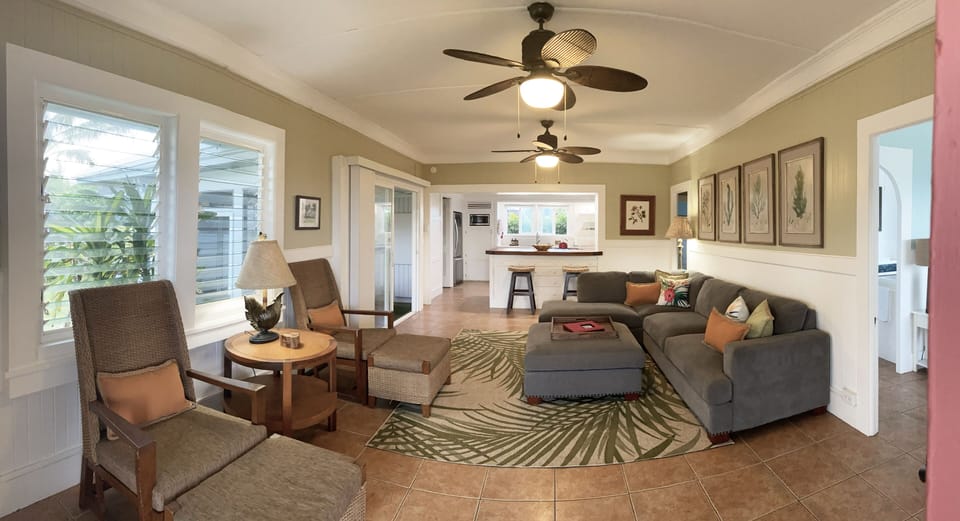 Large living room for entertaining the whole gang, with kitchen just behind bar