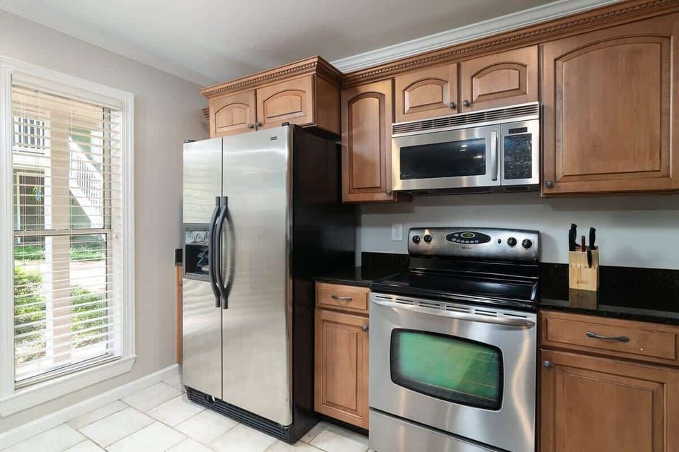 Full sized Fridge with a built in ice maker.