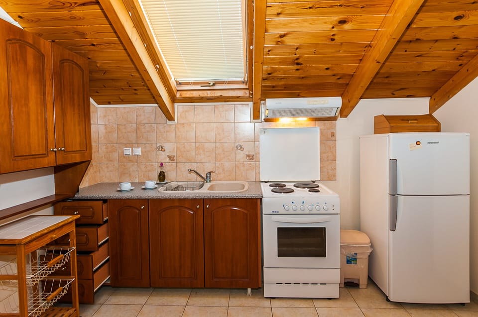 Apartment | Private kitchen | Fridge, stovetop, coffee/tea maker