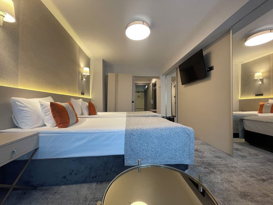 Economy Double Room | Minibar, desk, iron/ironing board, free WiFi