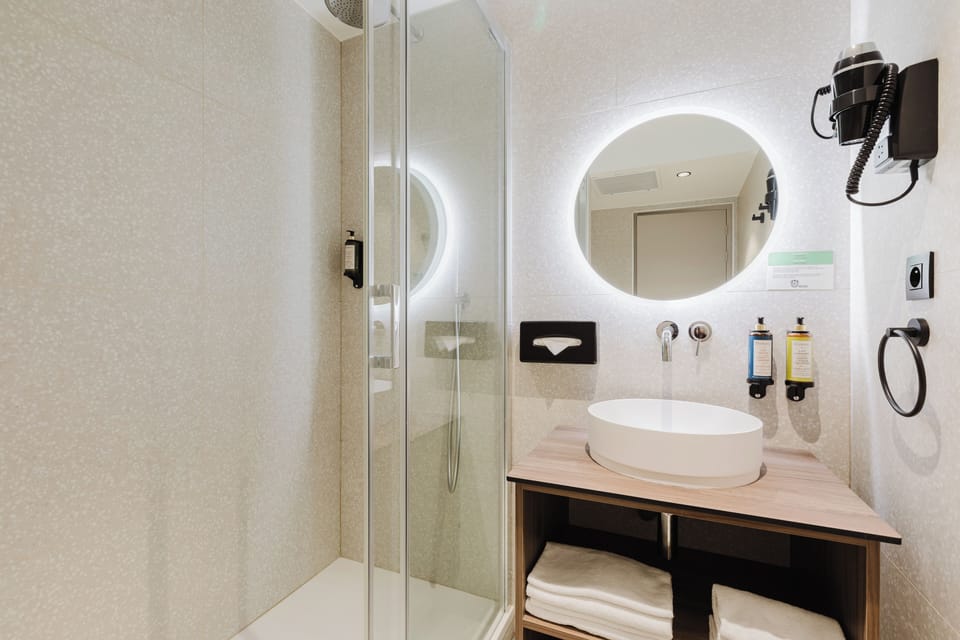 Shower, free toiletries, hair dryer, towels