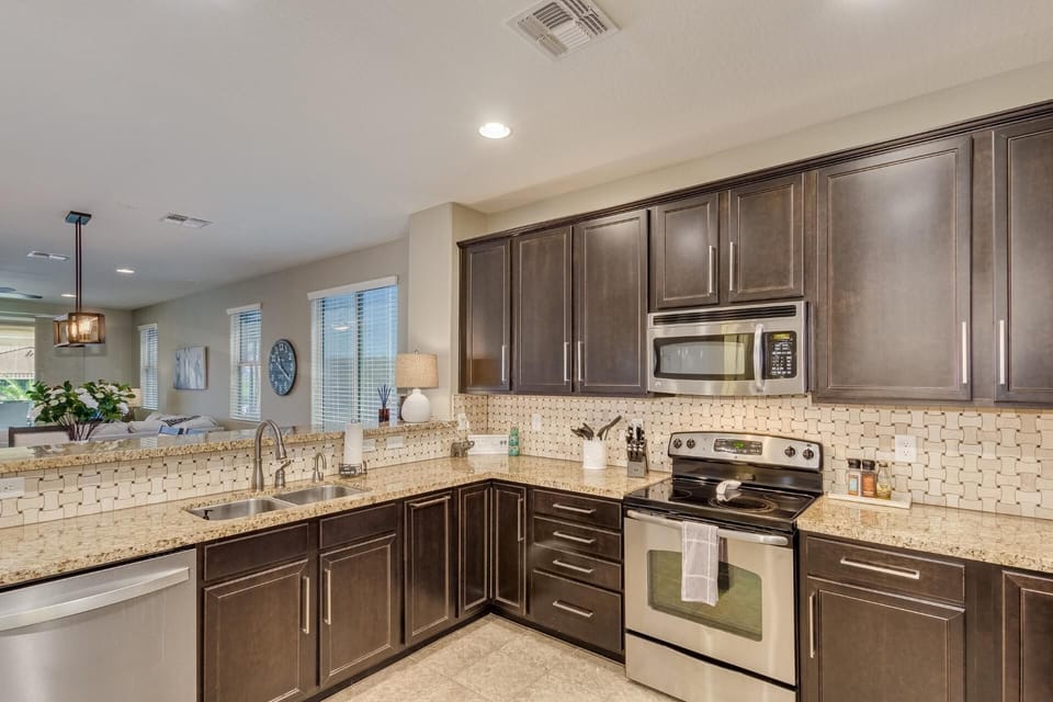 Upgraded kitchen with granite counters, SS appliances and all the needed cookware