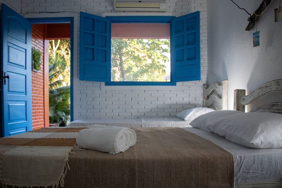 Standard Room, Lanai, Garden View | Minibar, free WiFi, bed sheets