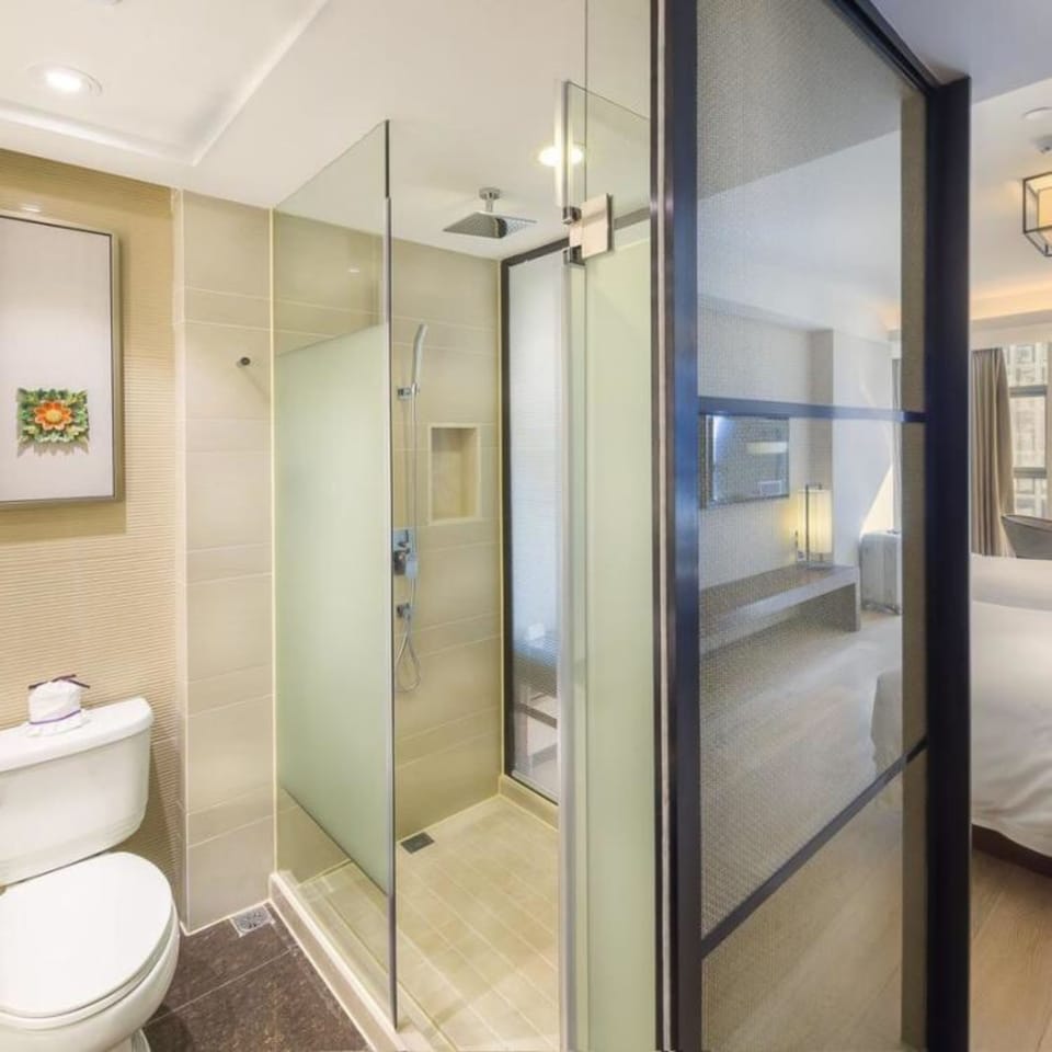 Deep soaking tub, rainfall showerhead, designer toiletries, hair dryer