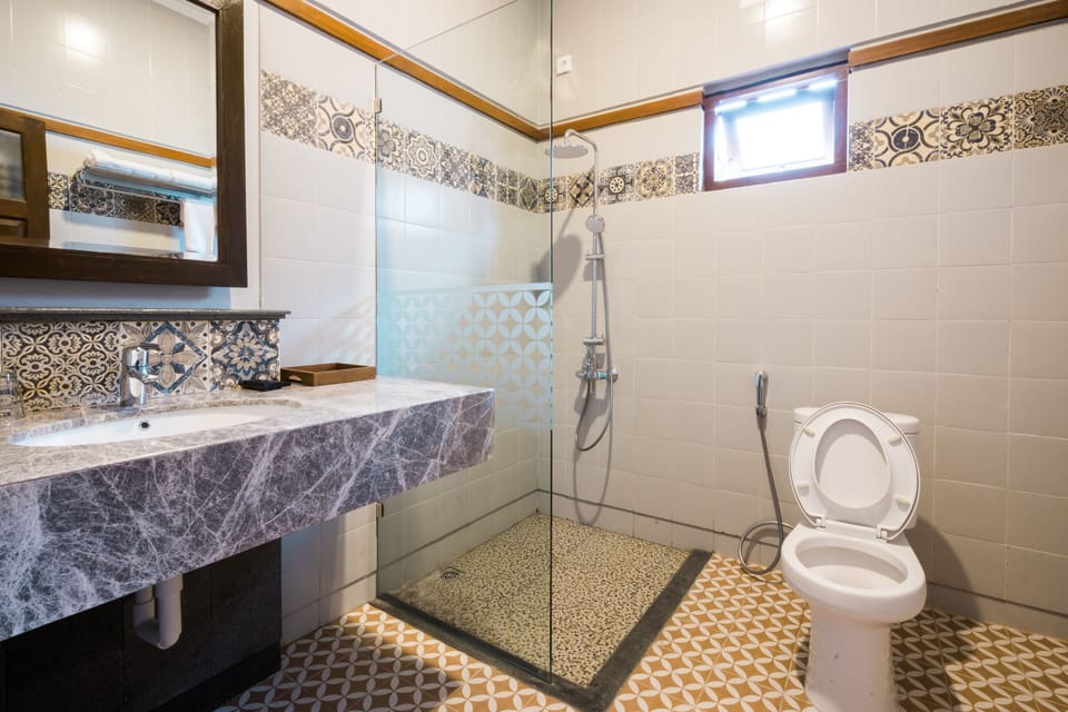Standard Double Room | Bathroom | Shower, hair dryer, slippers, towels