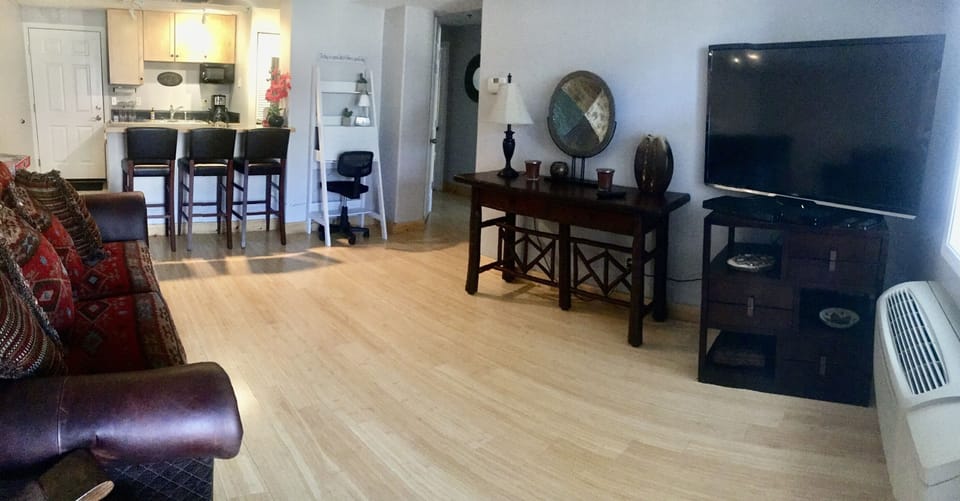 What a beautiful living room! Enough space for the queen air mattress.