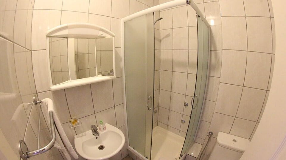 Shower, towels, shampoo, toilet paper