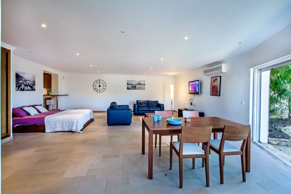Basement living & dinning area together with bedroom