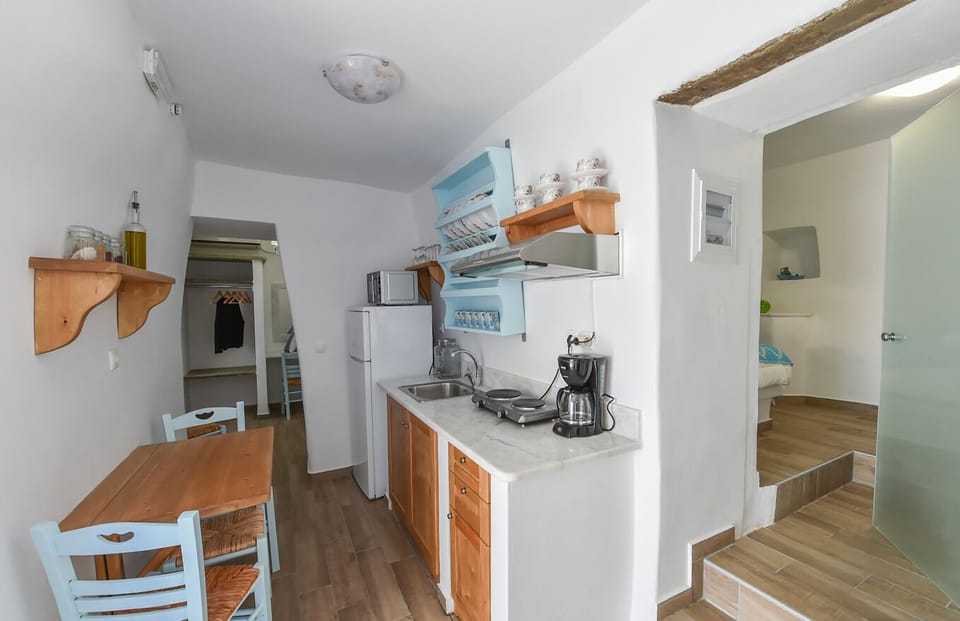 Kitchen with door to twin bedroom and looking into master bedroom.