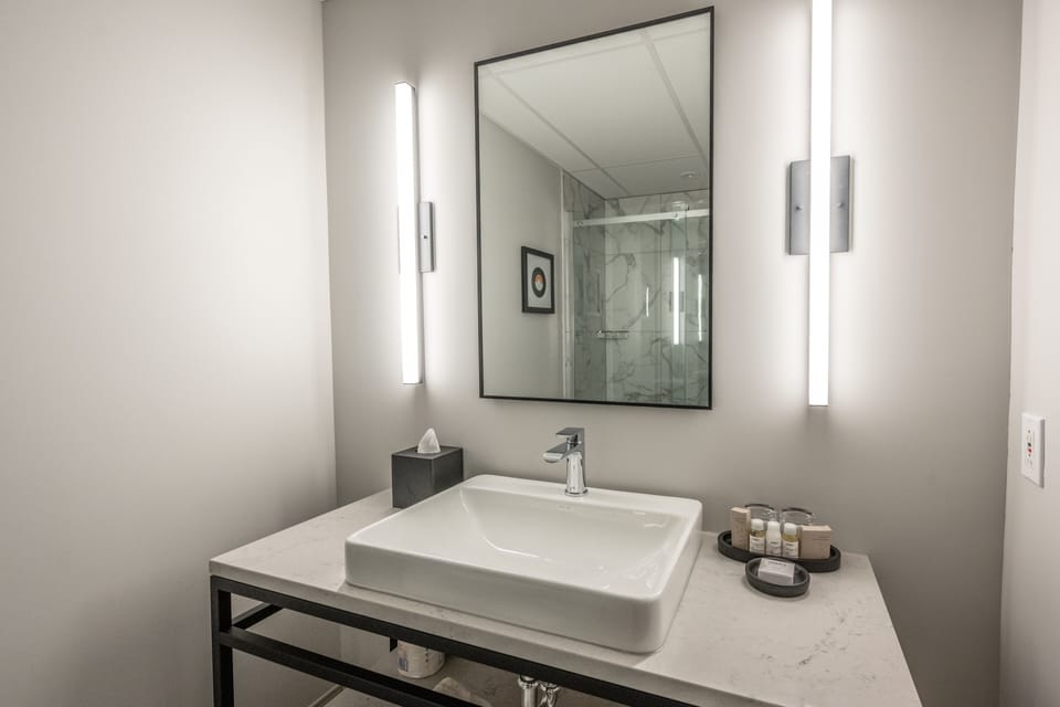 Shower, rainfall showerhead, designer toiletries, hair dryer