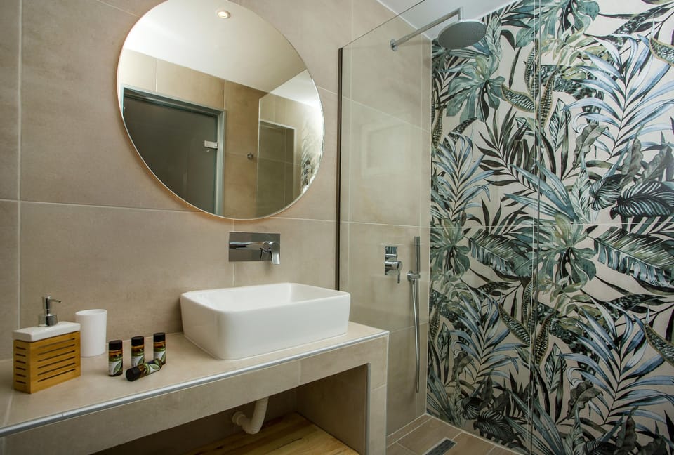 Shower, eco-friendly toiletries, hair dryer, towels