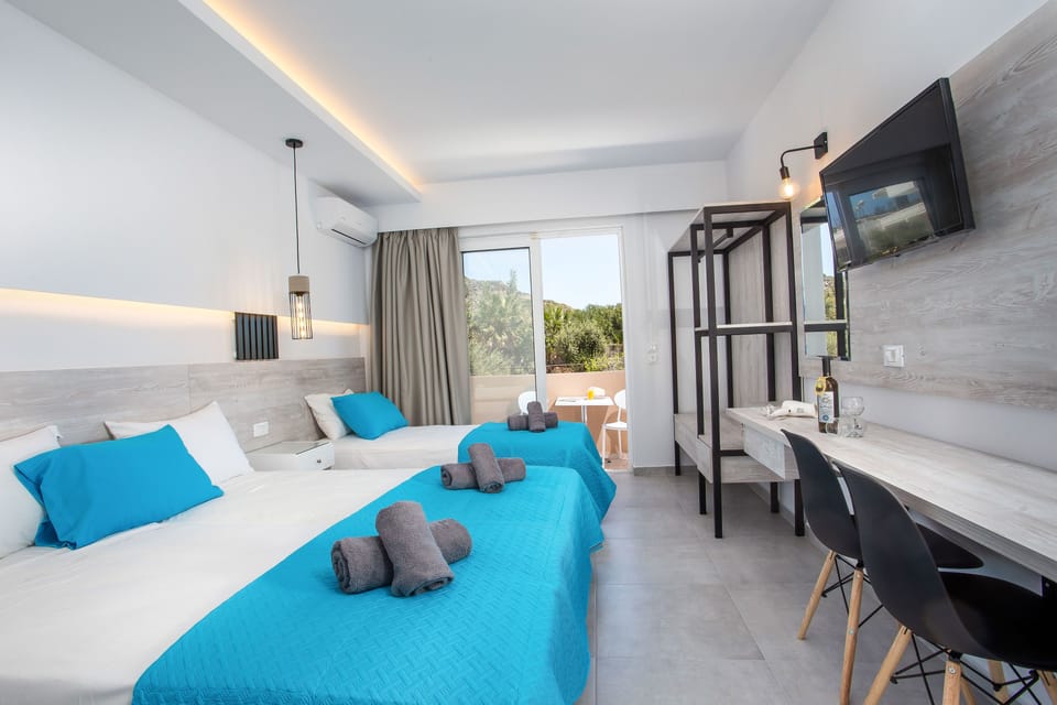 Deluxe Triple Room | 1 bedroom, hypo-allergenic bedding, in-room safe, blackout drapes