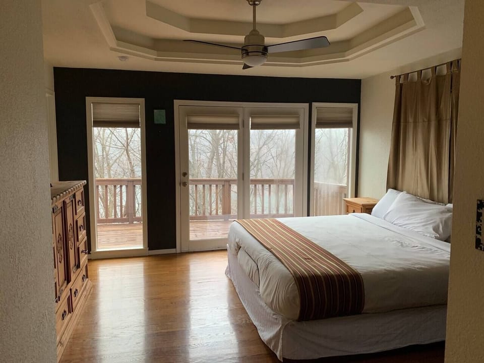 Master Bedroom: a cozy master suite featuring plush bedding, storage, and a calm ambiance.