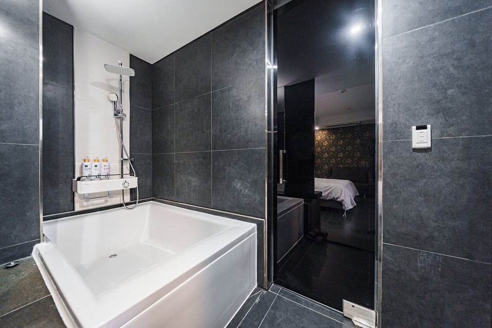 Separate tub and shower, hair dryer, bathrobes, slippers