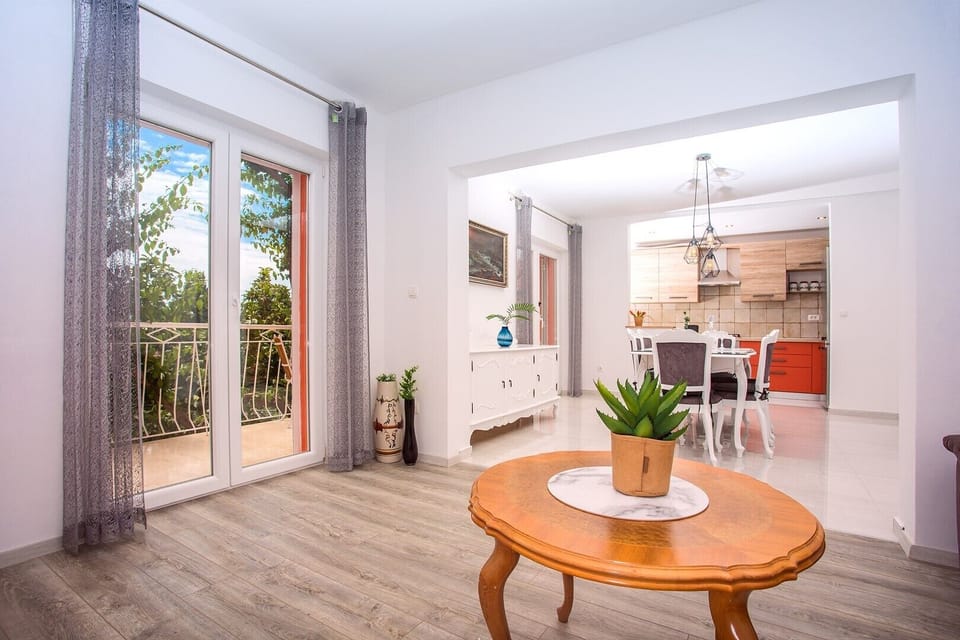 Living and dining area are connected with fully equipped kitchen.