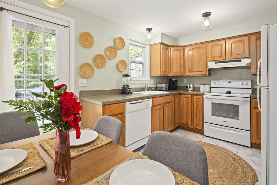 Kitchen cabinetry equipped with cooking/dining essentials